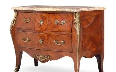 An early 20th century walnut commode, curved front with three drawers, decorated...