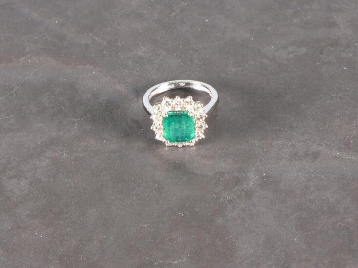 An emerald and diamond set dress ring, the emerald...