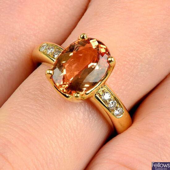 An orange topaz ring, with brilliant-cut diamond line shoulders, by H. Stern.