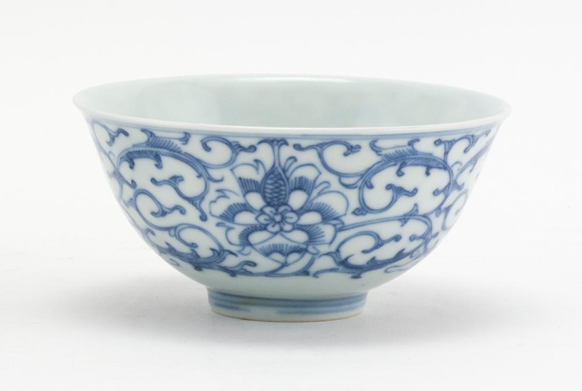 CHINESE BLUE AND WHITE PORCELAIN BOWL With lotus flower and vine decoration. Stylized mark on base. Height 2.5". Diameter 4.4".
