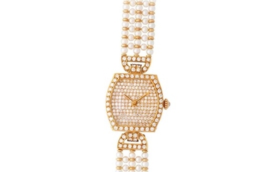 Cartier. Very Attractive and Particular Lady’s Tonneau Shaped Wristwatch in Yellow Gold, With Pave Diamond-Set Bezel, Dial and Clasp, With Five Line Pearls and Gold Bracelet
