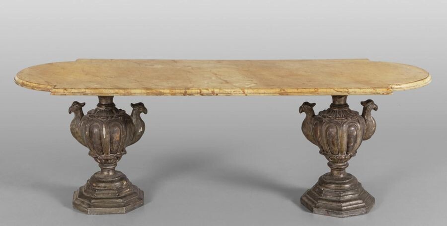 Coffee table with wooden top and feet formed by two carved and gilded wooden vases