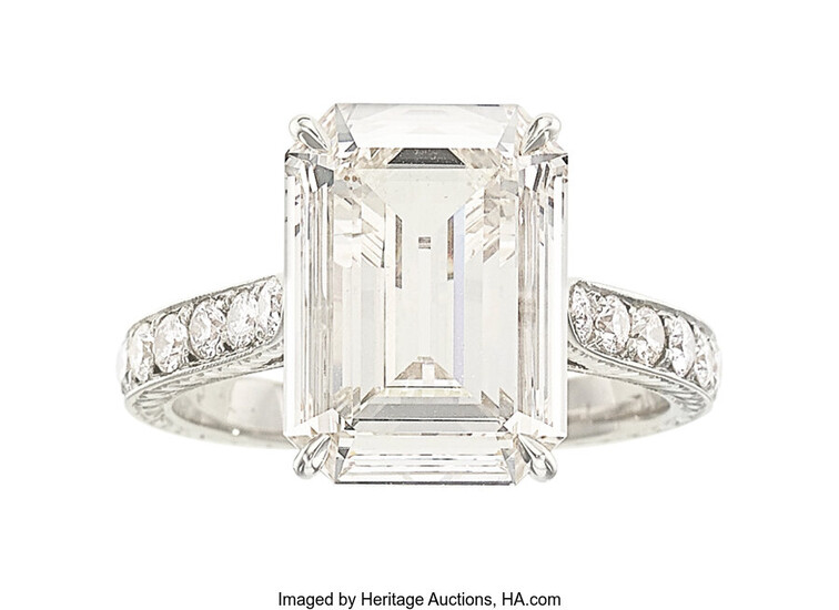 Diamond, White Gold Ring The ring features an emerald-cut...