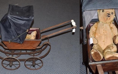 Early 20th century wooden dolls pram with hood and jointed...