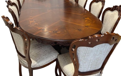 Extensive dining table with chairs