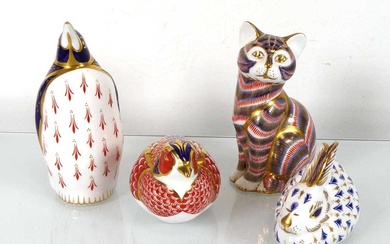 Four Royal Crown Derby paperweights modelled as a cat, a...