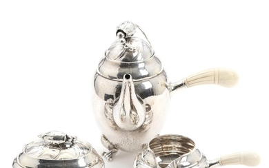 Georg Jensen: “Blossom”. A Danish hammered sterling silver coffee set comprising coffee pot, sugar and cream set. Weight app. 1205 gr. H. 7.3–19.5 cm. (3)