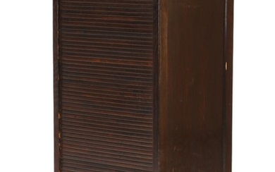 Hans J. Wegner: “B 5110”. A stained oak cabinet with roll-front, inside ten beech pull-out trays. Manufactured by Planmøbel. H. 107. W. 49. D. 41 cm.