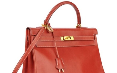 Kelly "35" bag in red box with white stitching, fasteners and clasps in gold metal, keys under bell, padlock, removable shoulder strap, handle