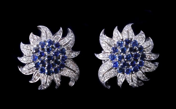**LOT WITHDRAWN** A pair of sapphire and diamond flower head earrings
