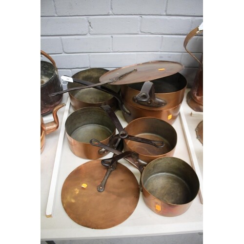 Lot of six antique and later French copper pans with wrought...