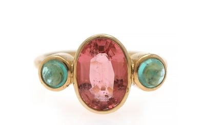 Natascha Trolle: A tourmaline and emerald ring set with an oval-cut tourmaline flanked by two cabochon emeralds, mounted in 18k gold. Size 53.