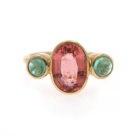 Natascha Trolle: A tourmaline and emerald ring set with an oval-cut tourmaline flanked by two cabochon emeralds, mounted in 18k gold. Size 53.