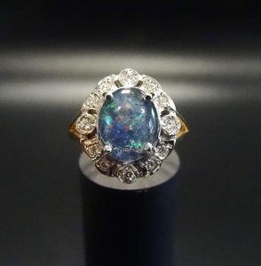 OPAL TRIPLET AND DIAMOND CLUSTER RING the central oval opal ...