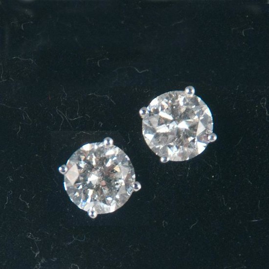 Pair of 14K white gold diamond studs with 1.44 total