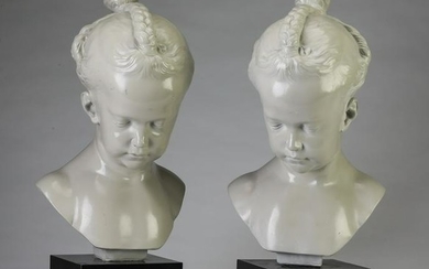 Pair of female child busts with braided hair. 19"h