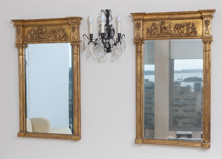 Pair of gilt gessoed bevelled mirrors in the classical taste,...