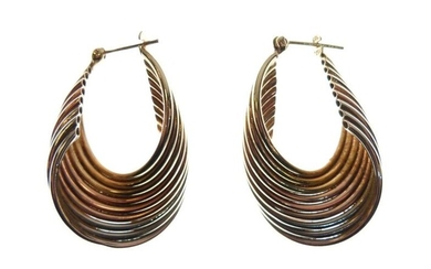 Pair of yellow metal earrings of twisted nine-strand design,...