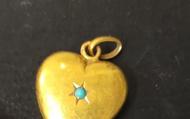 Pendentif cœur en or 18k (750e) ponctué d'un cabochon de turquoise en serti étoilé. Travail...