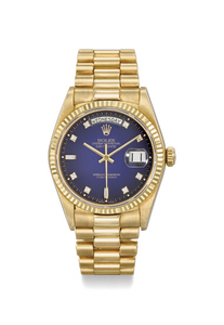 Rolex. A very fine and rare 18K gold and diamond-set automatic wristwatch with sweep centre seconds, day, date, bracelet, blue “dégradé dial”, display clip and box, SIGNED ROLEX, OYSTER PERPETUAL, DAY-DATE, REF. 18038, CASE NO 9’399’528, CIRCA 1985