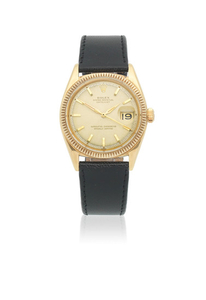 Rolex. An 18K gold automatic calendar wristwatch