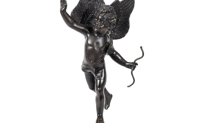Sculpture en bronze bleui. Elle représente Cupidon avec son arc sur un orbe étoilé. D'après...