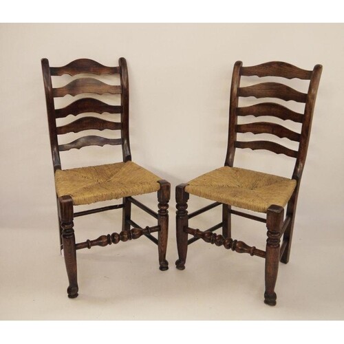 Set of eight early 20th century ladderback country chairs wi...