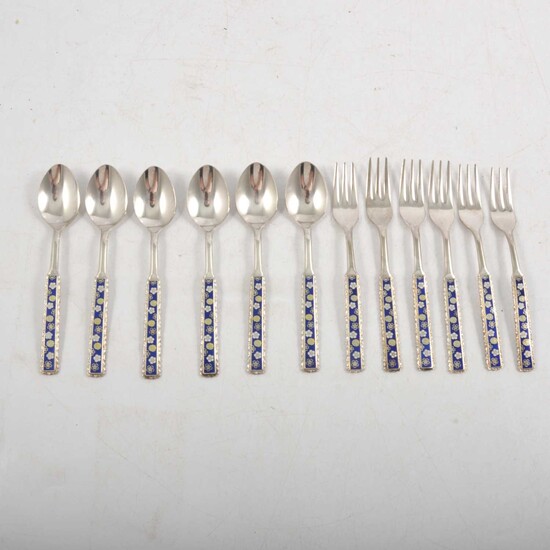 Set of six Japanese white metal spoons and forks.