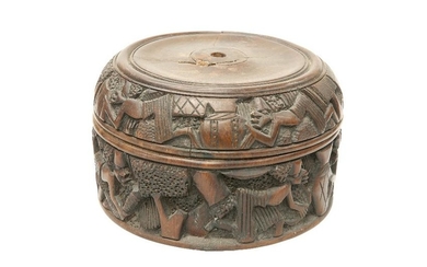 TRIBAL: A CARVED HARDWOOD BOX, circular with dished