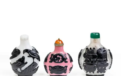 Three Chinese black overlay snuff bottles Qing dynasty, 19th century Comprising: a...