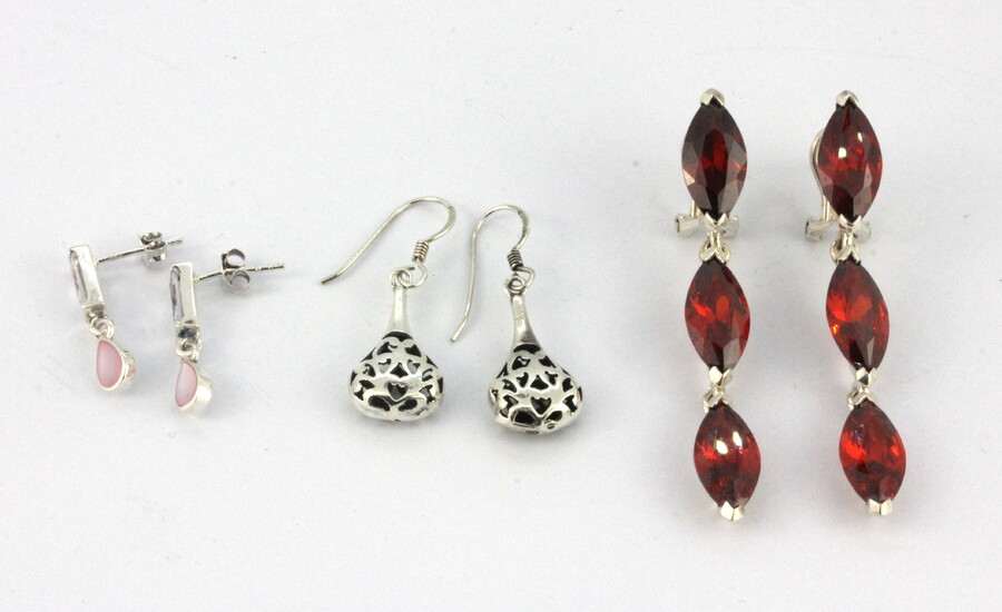 Three pairs of 925 silver stone set drop earrings.