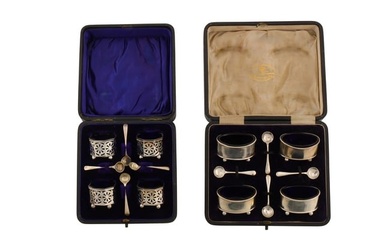 Two cased sets of Edwardian / George V sterling silver salts