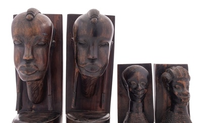 Two pairs of African carved ebony book ends, 20th century; a...