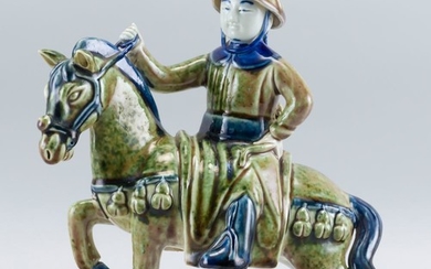 UNUSUAL CHINESE PEACHBLOOM GLAZE PORCELAIN FIGURE In the form of a rider on horseback. Length 9.5".