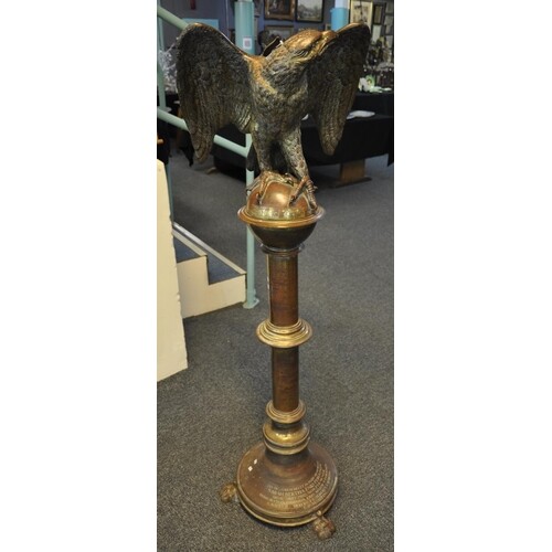Unusual heavy gilt brass memorial lectern, the pediment with...