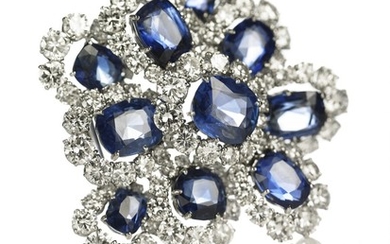 Van Cleef & Arpels: A sapphire and diamond brooch set with cushion-cut sapphires and brilliant-cut diamonds, mounted in platinum and 18k white gold. London 1960