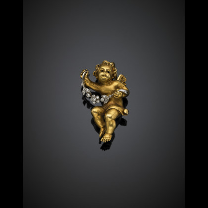 Yellow gold brooch with a putto holding a white...