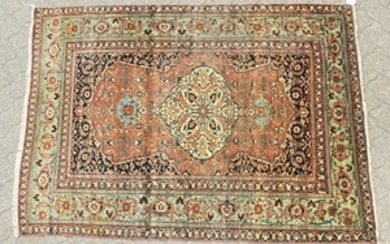 AN OLD PERSIAN TABRIZ RUG with large central motif and