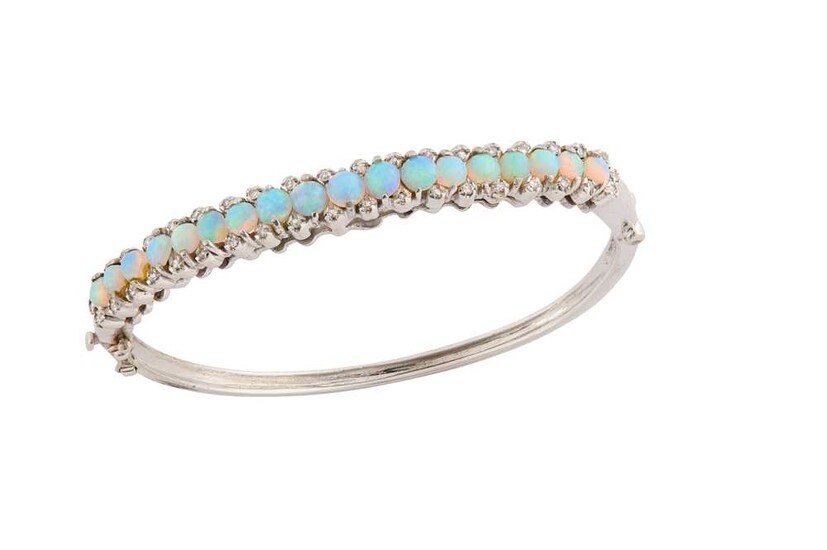 An opal and diamond bangle The hinged bangle set...