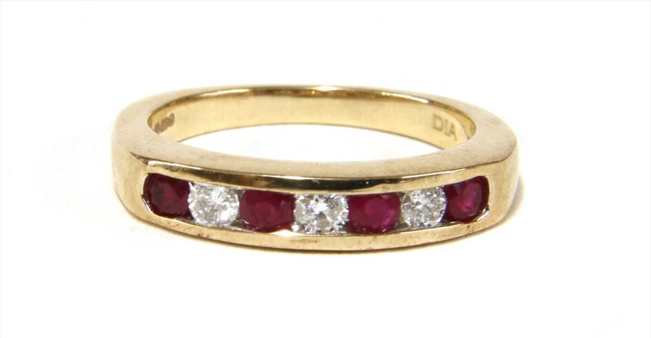 A 9ct gold ruby and diamond half eternity ring
