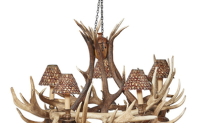 AN ANTLER CHANDELIER CONTEMPORARY the entwined antlers supporting five...