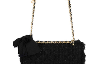 CAROLINE HERRERA - a black quilted tweed handbag.