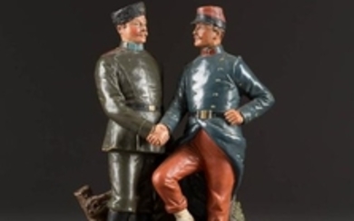 A CERAMIC FIGURE GROUP SHOWING A RUSSIAN AND A FRENCH