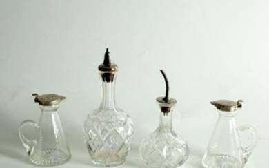 A pair of cruet bottles with silver mounts, H & H