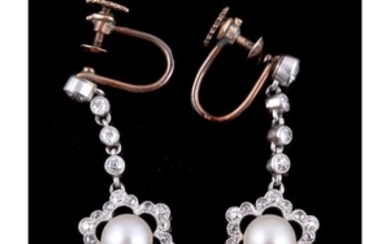 A pair of early 20th century button pearl and diamond ear pendants