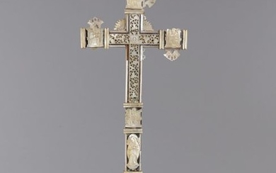 A large mother of pearl cross