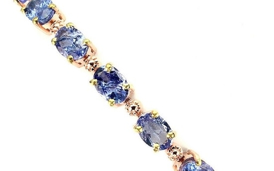 A tanzanite bracelet set with numerous oval-cut tanzanites, mounted in gold plated sterling silver. Adjustable length 18–21 cm.
