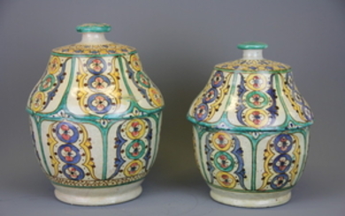 Two 19th/ early 20th Century North African hand painted pottery jars and lids, H. 28cm H. 25cm.