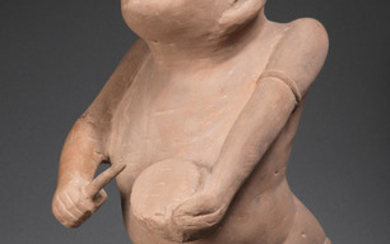 A very rare carved stone figure of a drummer