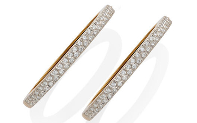 A pair of diamond and 18k gold bangle bracelets